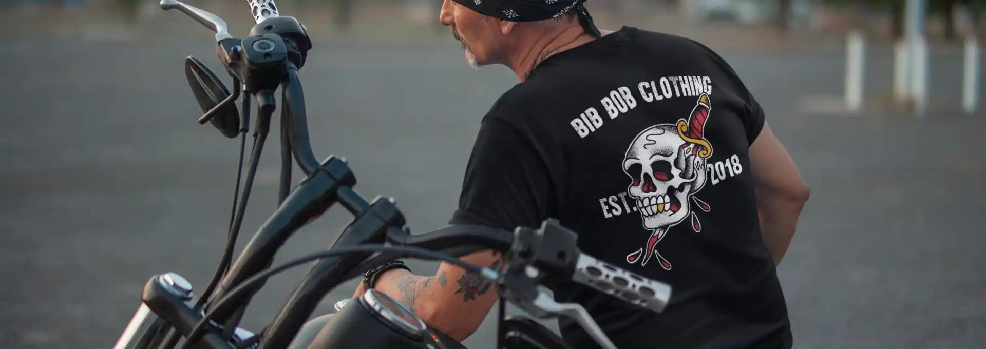 Black t-shirt with a skull and dagger graphic.